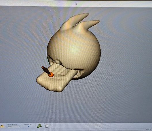 Figure 34 Smoothing Poro's tongue (photograph taken by Mark Warren)